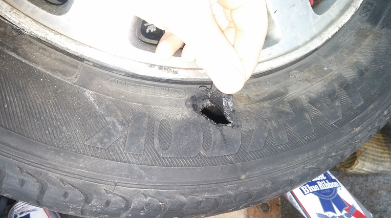 The ‘95 Accord slid into a curb and blew out the tire.